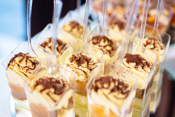 Delicious Layered Desserts in Clear Cups Displayed at a Festive Celebration Event