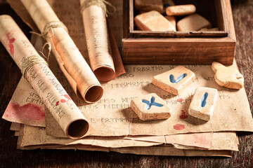 Futhark rune stones amd old scrolls as a mystical background