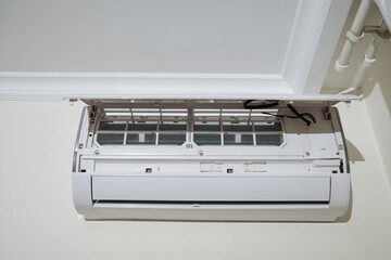 Open air conditioner cover, cleaning air conditioner filters from dirt and dust