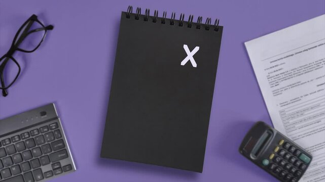 Tax time. Tax time letters blink in chaotic order. Notification of need to file tax return, tax form at accauntant workplace. Preparation, filing guidelines, and challenges.  Stop motion for business 