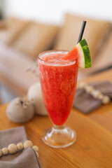 Fresh Red Watermelon Smoothie in a Tall Glass on Wooden Table - Refreshing Summer Drink