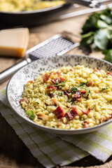 Italian risotto with pancetta, parmesan and parsley on a stylish plate
