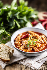 Tasty soup or stew made of beef tripe and spices. Spicy and aromatic tripe soup seasoned with pepper and served with bread
