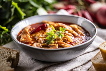 Tasty soup or stew made of beef tripe and spices. Spicy and aromatic tripe soup seasoned with pepper and served with bread