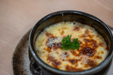 Mashed potato with cheese on top, serve in a bowl