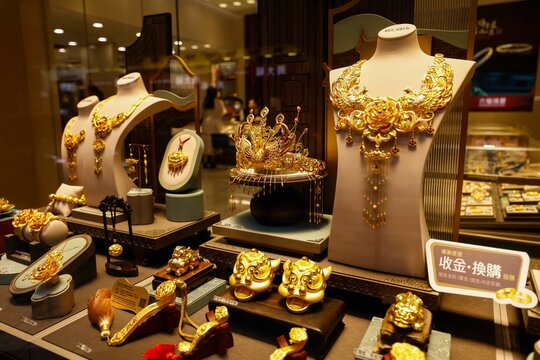 Macau, China -May 2, 2024: Hsieh Sui Lin, Luk Fook Jewelry and other brands of gold jewelry stores display a wide range of gold, platinum jewelry and gold crafts, becoming the street scenery of Macau.