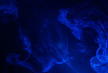 Obraz premium Blue smoke on black background
