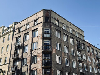 European disadvantaged area of ​​the city with old, unkempt buildings, peeling facades and garbage