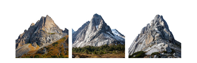 Three rocky mountain peaks rise up against a white sky.