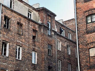 European disadvantaged area of ​​the city with old, unkempt buildings, peeling facades and garbage