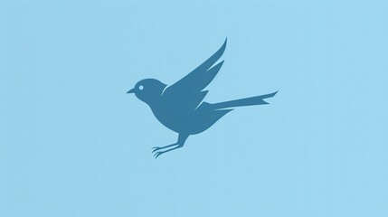 Obraz premium A blue bird in flight on a light blue background.