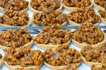 Walnuts tart cake form Perigord, Dordogne, fresh baked nuts cake on local farmers market in Saplat-du-Caneda, Perigord, France