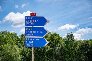 Driving in summer on road, road signs direction to Dijon, Paris, Lyon and other French cities, different types or roads in France, transportation and traffic