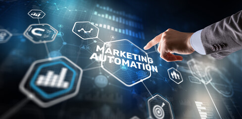 Marketing automation on the virtual screen. Man clicks on the inscription Marketing