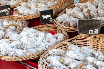 Variety of homemade dried salami sausages in French butchery shop, Dordogne, France, meat food...