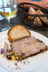 Terrine foie gras fat liver specialty food product made of liver of a duck or goose fattened by force feeding, served in French restaurant in Perigoed, Dordogne, close up