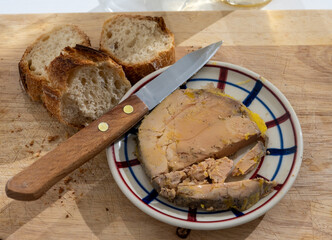 Foie gras fat liver specialty food product made of liver of a duck or goose fattened by gavage, force feeding, served in French restaurant in Perigoed, Dordogne, close up © barmalini