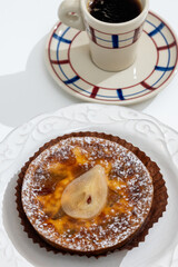 Homemade baked pear cake with caramel almond custard close up, traditional sweets of Perigord, Dordogne, France