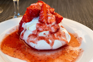 Sweet french dessert, Red strawberry fruit pavlova served in restaurant in Saint-Tropez, France