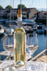 Glasses of cold rose gris Cote de Provence wine in yacht harbour of Port Grimaud, summer vacation on French Riviera in Provence, France, wine tasting