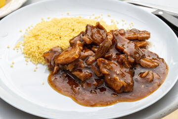 Meat dish Caramel pork served with couscous