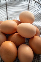 Organic brown chicken eggs from free-range organic farm in basket