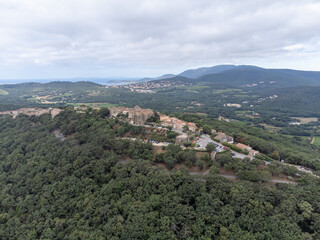 Obraz premium Landscape of French Riviera, view on hills, houses and green vineyards from above Cotes de Provence, production of rose wine near Saint-Tropez and Pampelonne beach, Var, France
