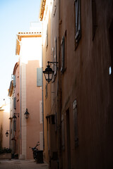 Walking in Saint-Tropez famous touristic village on French Riviera, summer vacation, colorful houses, Var, Provence, France