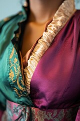 Fototapeta premium Elegant Fabric Details: A Close-Up of a Colorful, Ornate Garment with Green and Purple Textures for Fashion Inspiration