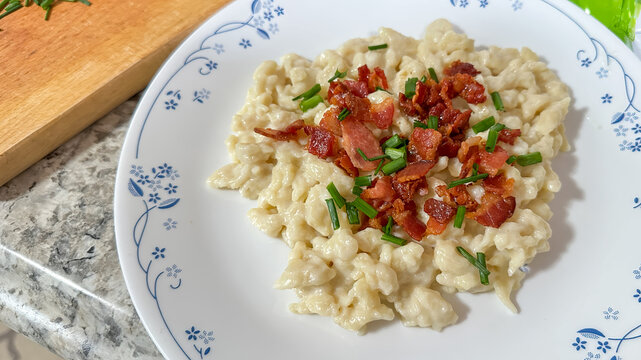 Traditional slovak dish dumplings with sheep cheese, chives and beacon from above