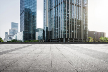 Fototapeta premium Modern Urban Landscape with Glass Buildings and Paved Plaza