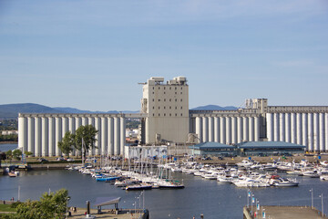Quebec City, Quebec, Canada - 6 September 2015: Industrial Grain Silos and Marina Landscape © Aleksandra