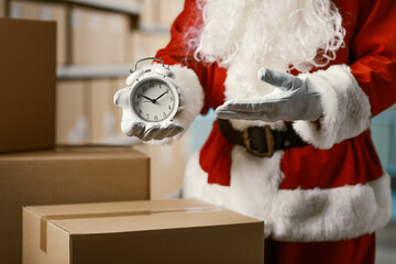 Santa Claus at the warehouse showing a clock
