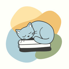 cat sleeping on a stack of books