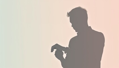 Silhouette of a person checking a watch against a soft gradient background with copy space