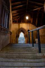  gothic building stairwell windows dim lighting handrail