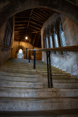  gothic building stairwell windows dim lighting handrail