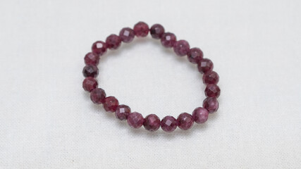 Natural gemstone bracelet display on white bqackground