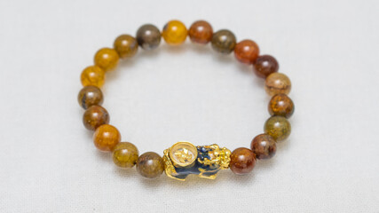 Natural gemstone bracelet display on white bqackground