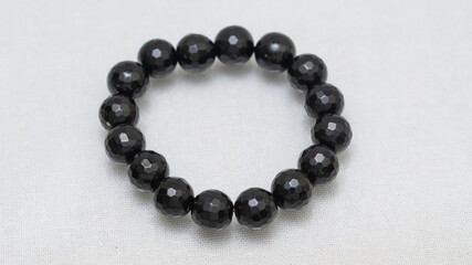 Natural gemstone bracelet display on white bqackground