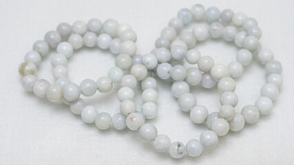 Natural gemstone bracelet display on white bqackground