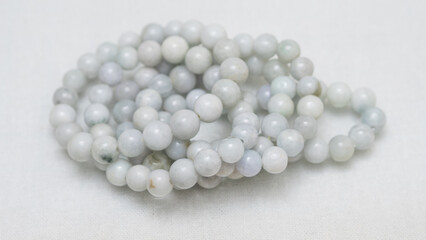 Natural gemstone bracelet display on white bqackground