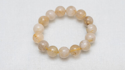 Natural gemstone bracelet display on white bqackground