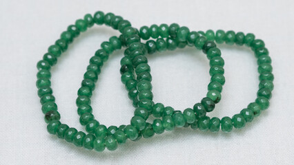 Natural gemstone bracelet display on white bqackground