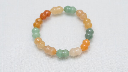 Natural gemstone bracelet display on white bqackground