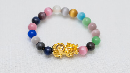 Natural gemstone bracelet display on white bqackground