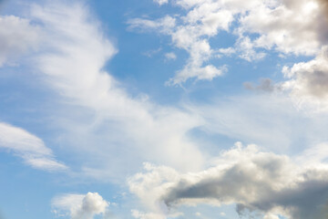 Obraz premium Soft gentle blue sky with light clouds. Calm texture. Nature abstract background. Fresh air, weather and freedom concept.