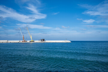 Fototapeta premium Cranes installed on a quay in the port of Monopoli in Italy