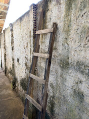 Antique wooden staircase leaning against the wall
