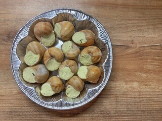 Snails sauce Burgundy top view. Escargots, traditional French cuisine. 